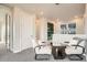 Inviting living area featuring neutral tones, modern decor, and an abundance of natural light at 1764 Peak Loop, Broomfield, CO 80023