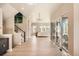 Spacious living room featuring hardwood floors, a modern chandelier, and sliding glass doors to the outdoor patio at 1764 Peak Loop, Broomfield, CO 80023