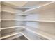 Bright pantry featuring open shelving and storage options at 1764 Peak Loop, Broomfield, CO 80023