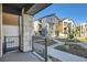 Outdoor patio with stone pillar overlooking landscaped community at 1764 Peak Loop, Broomfield, CO 80023