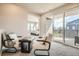Cozy sitting area connecting to bedroom and outdoor balcony, bright natural light at 1764 Peak Loop, Broomfield, CO 80023