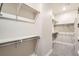 Spacious walk-in closet with ample shelving and storage, providing plenty of room for clothing and accessories at 1764 Peak Loop, Broomfield, CO 80023