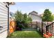 Backyard with privacy fence, garden beds and flowers at 6654 Pecos St, Denver, CO 80221
