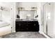 Modern primary bathroom with double vanity, granite counters, and glass-enclosed shower at 6654 Pecos St, Denver, CO 80221