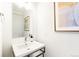 Clean powder room with modern sink, fixtures, and decor at 6654 Pecos St, Denver, CO 80221
