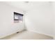 Cozy bedroom with neutral carpet and small window at 6654 Pecos St, Denver, CO 80221