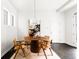 Contemporary dining room with a round table, stylish chairs, and elegant lighting at 6654 Pecos St, Denver, CO 80221