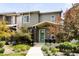 Charming two-story home with well-manicured front yard and inviting green front door at 6654 Pecos St, Denver, CO 80221