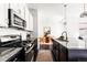 Well-equipped kitchen with modern appliances, sleek countertops, and ample storage at 6654 Pecos St, Denver, CO 80221