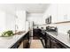 Stylish kitchen featuring granite countertops, stainless steel appliances, and ample cabinet space at 6654 Pecos St, Denver, CO 80221