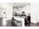 Beautiful kitchen with granite countertops, stainless steel appliances, and a functional island with seating at 6654 Pecos St, Denver, CO 80221