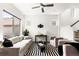 Contemporary living room with a neutral color palette, stylish rug, and comfortable seating at 6654 Pecos St, Denver, CO 80221