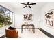Bright office with a large window, modern decor, and stylish furniture at 6654 Pecos St, Denver, CO 80221