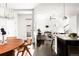 Inviting open floorplan seamlessly connects the dining area and living room, enhancing the sense of space and flow at 6654 Pecos St, Denver, CO 80221