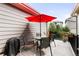 Outdoor patio features a table and chairs with umbrella, perfect for relaxing and entertaining at 6654 Pecos St, Denver, CO 80221