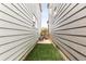 Narrow fenced yard with artificial grass at 6654 Pecos St, Denver, CO 80221