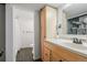 Basement bathroom with a shower/tub combo, vanity, and linen storage at 11473 Garfield St, Thornton, CO 80233