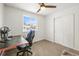 Bedroom with built-in shelving and large window at 11473 Garfield St, Thornton, CO 80233