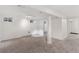 Versatile carpeted basement featuring neutral colors and recessed lighting, providing a blank canvas for customization at 3190 S Detroit St, Denver, CO 80210