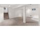Spacious carpeted basement offering endless possibilities for recreation, storage, or additional living space at 3190 S Detroit St, Denver, CO 80210