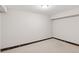 Clean basement featuring white walls, neutral flooring, and low ceilings at 3190 S Detroit St, Denver, CO 80210