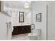 Modern bathroom featuring elegant vanity, updated fixtures, walk-in shower, and bright lighting at 3190 S Detroit St, Denver, CO 80210