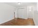 Well-lit bedroom with hardwood floors, closet and neutral walls offer a comfortable and versatile space at 3190 S Detroit St, Denver, CO 80210