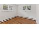 Bright bedroom with hardwood floors, natural light and large windows providing a tranquil and inviting space at 3190 S Detroit St, Denver, CO 80210