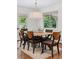 Cozy dining room featuring a wood table, six chairs, and ample natural light at 3190 S Detroit St, Denver, CO 80210