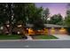 Charming single-Gathering home with brick exterior, mature trees, and a well-manicured front yard at 3190 S Detroit St, Denver, CO 80210