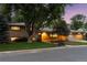 Attractive home with a brick front, well-lit windows, and professional landscaping at 3190 S Detroit St, Denver, CO 80210