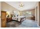 Serene main bedroom featuring neutral tones, large windows, and a comfortable bed at 22560 E Rowland Dr, Aurora, CO 80016