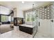 Stunning bathroom with a fireplace, freestanding tub, and glass enclosed shower at 860 Quintana Ln, Erie, CO 80516
