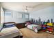 Bright bedroom with two twin beds, colorful decor, and plenty of storage, ideal for children at 860 Quintana Ln, Erie, CO 80516