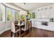 Charming dining area with a bay window and stylish light fixture at 860 Quintana Ln, Erie, CO 80516
