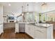 Open concept kitchen with a center island, stainless appliances, and a dining area at 860 Quintana Ln, Erie, CO 80516