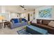 Upstairs loft space featuring comfortable seating, a cozy atmosphere, and ample natural light at 860 Quintana Ln, Erie, CO 80516