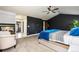 Spacious main bedroom featuring a fireplace, ceiling fan, and adjoining bathroom at 860 Quintana Ln, Erie, CO 80516