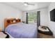 Bedroom with light walls and carpet floors, ceiling fan, lots of natural light, plus two pet beds at 10223 Vine Ct, Thornton, CO 80229