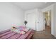 Bright bedroom with closet and doorway at 10223 Vine Ct, Thornton, CO 80229