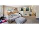 Living room with carpet, lots of seating, plus views to the kitchen and dining area at 10223 Vine Ct, Thornton, CO 80229