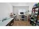 Bright office featuring a large window, desk, rolling chair, and ample storage space at 10223 Vine Ct, Thornton, CO 80229