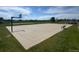 Community basketball court featuring an all-weather surface with hoop and seating areas at 203 S Oak Hill St, Aurora, CO 80018