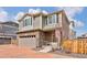 Charming two-story home with a stone-clad facade and an attached two-car garage at 203 S Oak Hill St, Aurora, CO 80018