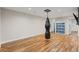 Finished basement featuring hardwood floors, recessed lighting, a boxing bag, and built-in storage at 2999 S Adams St, Denver, CO 80210