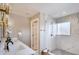 Modern bathroom with a double vanity, walk-in shower with glass enclosure, and stylish fixtures at 2999 S Adams St, Denver, CO 80210