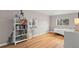 Bedroom featuring hardwood floors, a bookshelf, and a window overlooking the yard at 2999 S Adams St, Denver, CO 80210