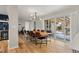 Elegant dining room featuring hardwood floors, modern light fixture, and sliding glass doors to the backyard at 2999 S Adams St, Denver, CO 80210