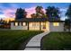 Charming single-story home with a well-maintained lawn and a welcoming walkway leading to the front door at 2999 S Adams St, Denver, CO 80210