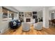 Inviting living room with hardwood floors, fireplace, built-in shelving, and modern furnishings at 2999 S Adams St, Denver, CO 80210